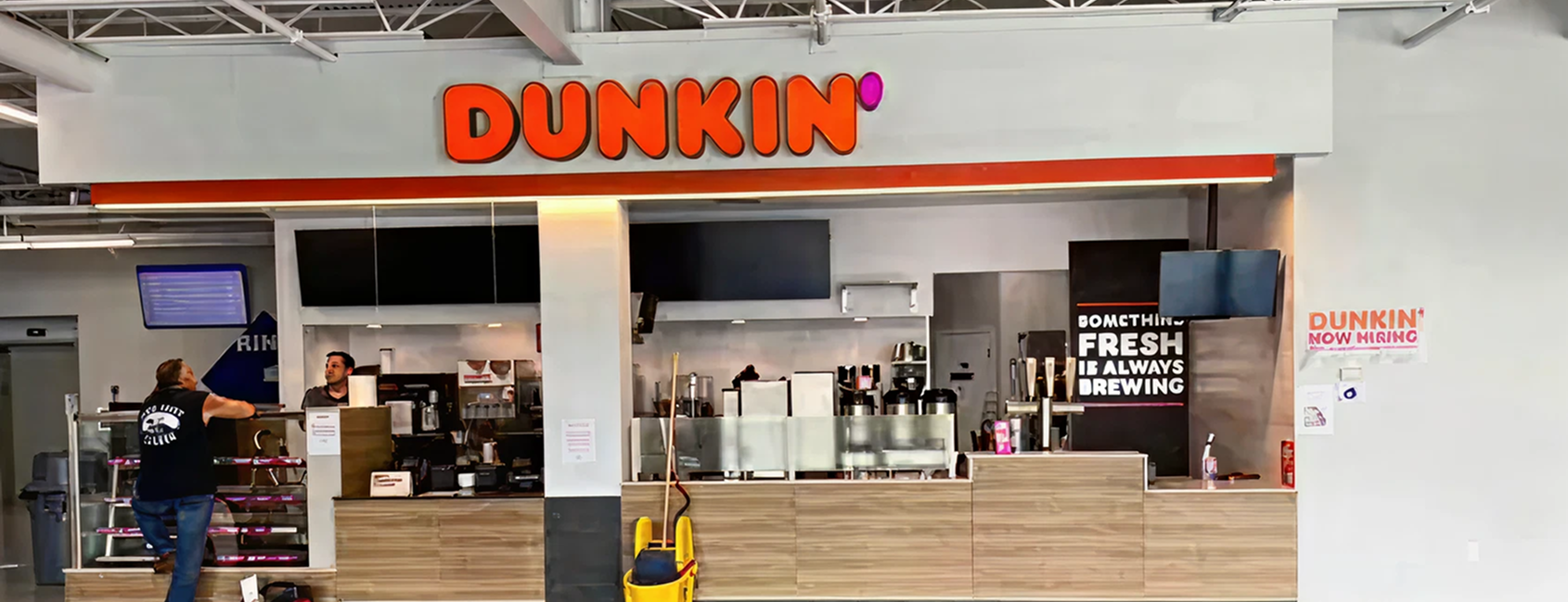 Dunkin' counter with staff